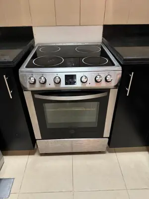 a stove top oven sitting in a kitchen at Stylish beachside apartment 3 beds in JBR in Dubai