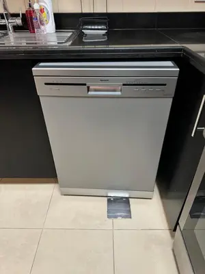 a dishwasher in a kitchen next to a counter at Stylish beachside apartment 3 beds in JBR in Dubai