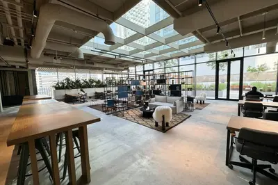 an office with a large room with tables and chairs at Stylish Studio in Upside Living with Top Amenities in Dubai