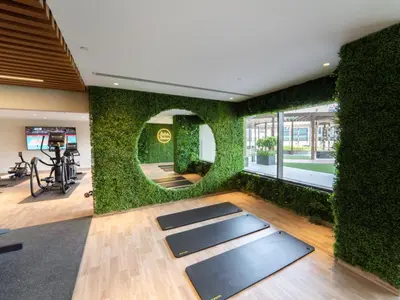 a room with a wall covered in ivy at Spacious 1BR - Elite Downtown Residence - Short Walk to Burj & Dubai Mall in Dubai