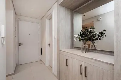 a bathroom with a vase of flowers on a counter at Seven Palms in Dubai