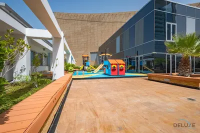 a playground in the courtyard of a building at Exclusive Studio at Sky Gardens, DIFC by Deluxe Holiday Homes in Dubai