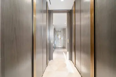 a hallway with wooden walls and a hallway with a hallwayngthngthngthngthngth at Five Palm Luxury - 2BR with Pool View, Gym & Prime Beach Stay in Dubai