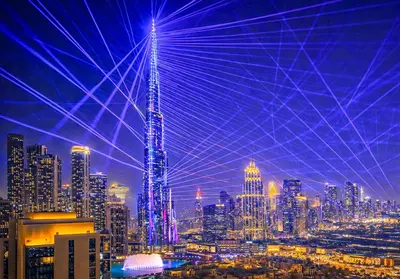 a view of a large city at night at Elite Royal Apartment - Sky Series - Panoramic Burj Khalifa, Skyline & Fountain View - Admiral in Dubai