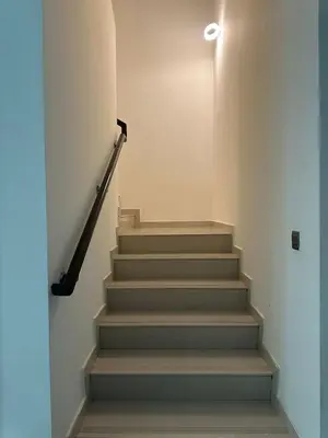 a stairway with a stair case in a building at Villa Townhouse in Dubai
