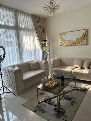 a living room with a couch and a coffee table at Villa Townhouse in Dubai