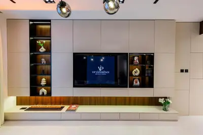 a room with a tv on a wall at VIP Experience Dubai Downtown at Boulevard Central T2 - Burj Khalifa View - Modern Luxury Apartments in Dubai