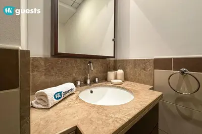 a bathroom counter with a sink and a mirror at HiGuests - Exclusive Downtown Dubai 1BR Apt at 29 Boulevard in Dubai