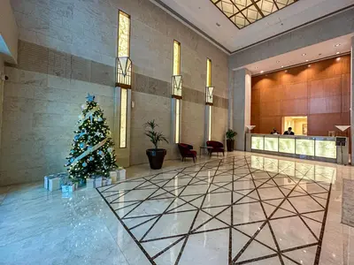 a christmas tree in the lobby of a hotel at HiGuests - Exclusive Downtown Dubai 1BR Apt at 29 Boulevard in Dubai