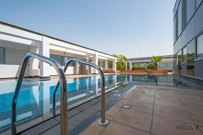 a swimming pool in the side of a building at Stylish Studio at Sky Gardens, DIFC by Deluxe Holiday Homes in Dubai