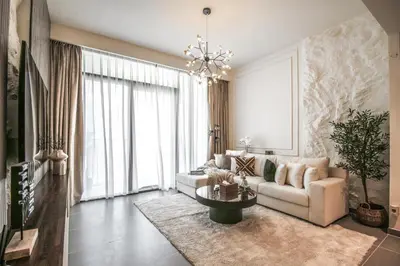 a living room with a couch and a table at Trophy - Ultra Luxury Suite with Fireplace in Dubai