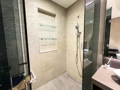 a bathroom with a shower and a sink at Naseem - Stylish 1BR Hotel Apartment Overlooking the Marina in Dubai