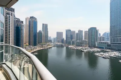 a view of a river in a city with buildings at Gala Guests - Stunning Front-Row Marina Views at The Point in Dubai