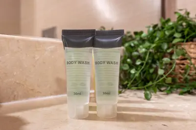 two bottles of baby wash sitting on a counter at Gala Guests - Deluxe Sparkle Residences Dubai Marina in Dubai
