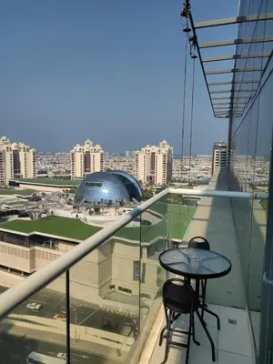 a balcony with two tables and a view of a city at 7 palm jumeirah West Beach in Dubai