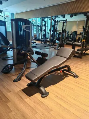 a gym with several treadmills and elliptical machines at 7 palm jumeirah West Beach in Dubai