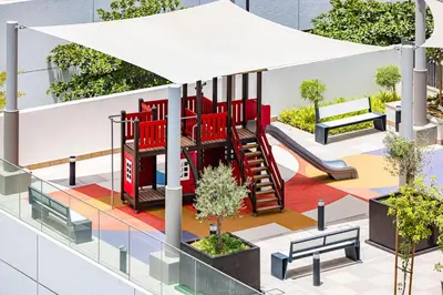 a rendering of a playground with a slide at Daniels Poolside Studio in Meydan in Dubai