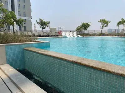 a swimming pool with a water slide in a building at Luxury at Socio Dubai Hills, 2 Beds, Sleeps 4 - DVH Holiday Homes in Dubai