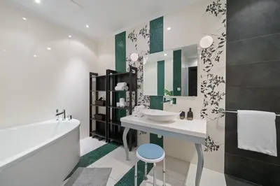 a bathroom with a sink and a mirror at Stellar 2BR on Palm Jumeirah - Beach and Pool access in Dubai