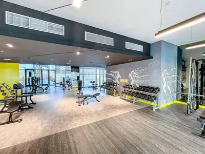 a gym with a bunch of chairs and machines at Vacationer I Elegant 2 Bedroom I Business Bay I Central & Convenient I Aykon City Tower in Dubai
