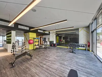 a gym with chairs and equipment in a building at Vacationer I Elegant 2 Bedroom I Business Bay I Central & Convenient I Aykon City Tower in Dubai