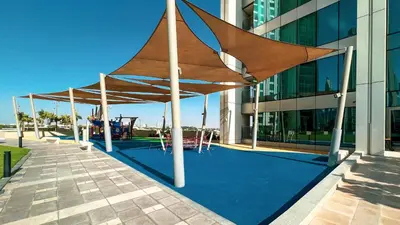 a large wooden canopy in front of a building at Stunning Two-Bedroom Apartment with Skyline View & walk to Dubai Mall by TerraHome in Dubai