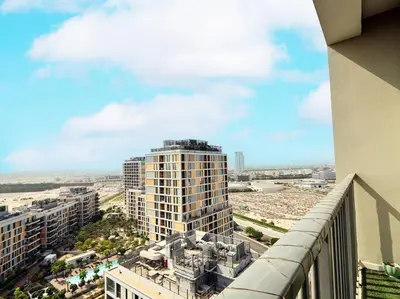 a view of a city from the balcony of a building at StoneTree - Fully Furnished - Dania 2 in Dubai