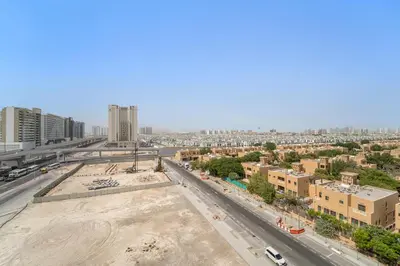 an aerial view of a city with buildings at StoneTree - Newly Furnished - Al Furjan in Dubai