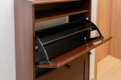 a drawer in a wooden cabinet with a handle at Elite Escape - 1 BHK Getaway in Azizi Riviera in Dubai