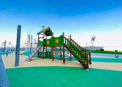 a playground with a slide in a park at Luminous 2 BR - Sobha Reserve in Dubai