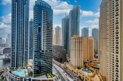 an aerial view of a city with tall buildings at Peaceful Waterfront Marina View in Dubai