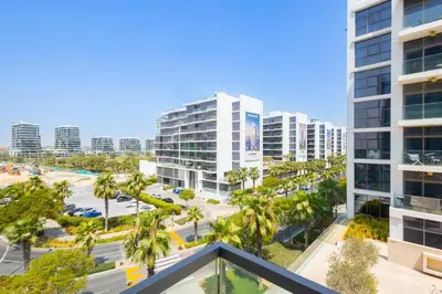 an aerial view of a city with tall buildings at Serenity Living - stunning 1BR, DAMAC Hills in Dubai
