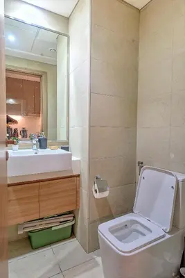 a bathroom with a toilet and a sink at Paradise Point in Dubai