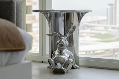 a silver rabbit shaped table in front of a window at New building l Near Metro l Spacious lay out in Dubai