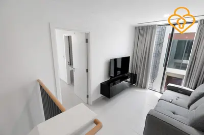 a living room with a couch and a tv at Keysplease 4BR Villa walking to pool, Cherrywoods Family Community in Dubai