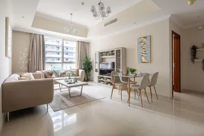a living room with a couch and a table at Frank Porter - Dunya Tower in Dubai