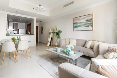 a living room with a couch and a table at Frank Porter - Dunya Tower in Dubai