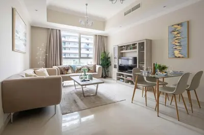 a living room with a couch and a table at Frank Porter - Dunya Tower in Dubai