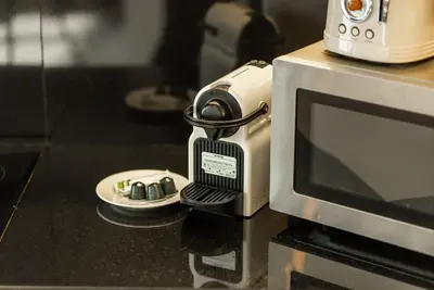 a camera sitting on top of a microwave at Apartments in Address Dubai Marina Residences connected to Marina Mall in Dubai