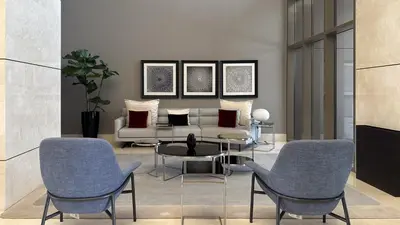a living room with a couch and chairs and a table at Waves - Premium Seaside Retreat With Private Beach in Dubai