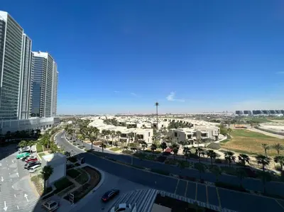 an aerial view of a city with tall buildings at Damac Golf vita in Dubai