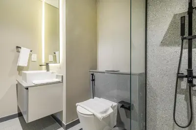 a bathroom with a toilet and a shower at Bespoke Holiday Homes - Mag Eye Residence in Dubai