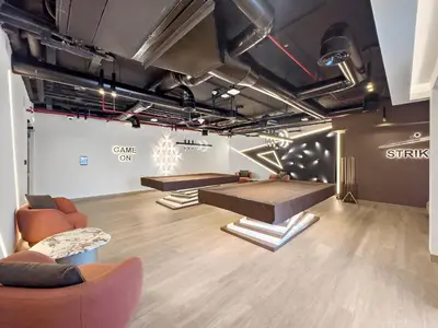 a room with couches and a table in a room at Elegant 1 BR Apartment near Mall of the Emirates in Dubai