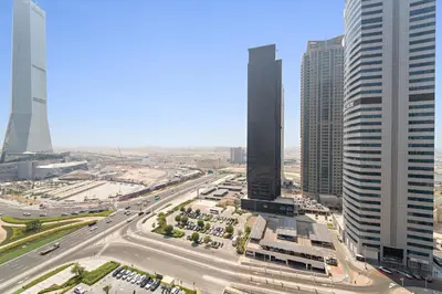 an aerial view of a city with tall buildings at Elegant 1 BR Apartment near Mall of the Emirates in Dubai