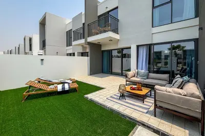 a living room with a couch and a table at Frank Porter - La Rosa 6 in Dubai