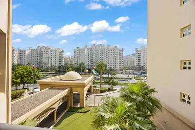 a view of a city from a balcony with buildings at 2BDR Luxury Apartment in Palm in Dubai
