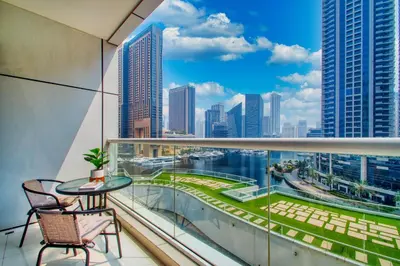 a balcony with a view of the city at ShoresInn - Charming 1BR with Marina Views in Dubai
