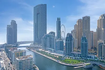 an aerial view of a city with a river and buildings at Savis Homes - Condor Marina Star - Luxury 2 BR Waterfront Apartment in Dubai