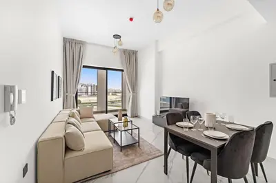 a living room with a couch and a table at Amazing 1 Bdr luxury residence Dubai Arjan in Dubai