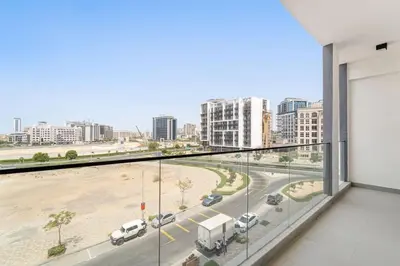 a balcony with a view of a parking lot at Amazing 1 Bdr luxury residence Dubai Arjan in Dubai